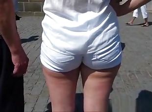 Candid arse in short taut shorts three