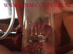 Miss M. PUMPS her slave's COCK and BALLS while he is CAGED!