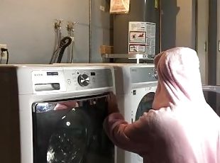Bunny onesie humps dryer while doing laundry