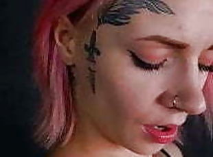 Girl with a tattoo on her face, playing with her pussy