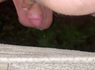 Shaved small cock crouch pissing outdoors