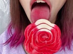 Naughty stepsister sucks a lollipop and show her long hot sexy tongue