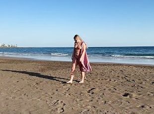 Girl Walking on the beach and flashing body on public