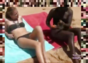 Guy fucks black and white girls on the beach