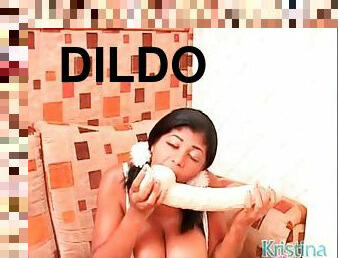 Kristina Milan sucking on her huge dildo