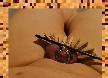 Sub in chastity with clothes pins on balls gets caned