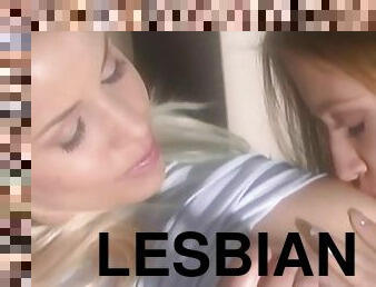Gorgeous lesbians passionately lick pussy and use strap-on while dude smokes a cigar