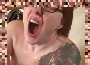 Hot redhead wearing glasses gets a facial