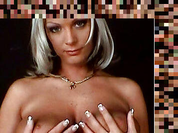 Sexy blonde Sheila Grant demonstrates her boobies
