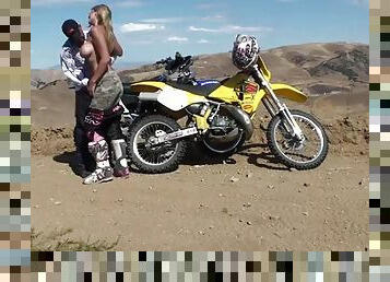 Hot sex with a busty motocross babe outdoors