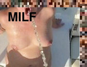 MILF gets golden shower on boat