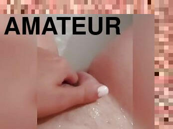 Wet girl fingering herself in bathtub