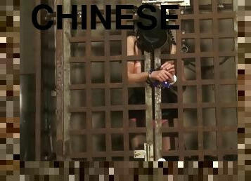 Chinese Female Prisoner Hooded And Chained