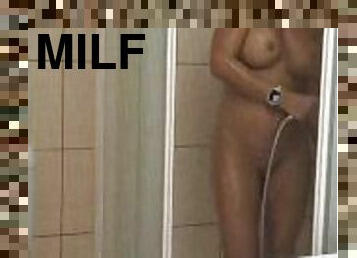 AMAZING HOT MILF TAKING SHOWER,WHILE CUCKOLD HUSBAND FILMING IT FROM THE STREET