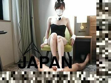 Japanese bunny girl gives a guy a foot job