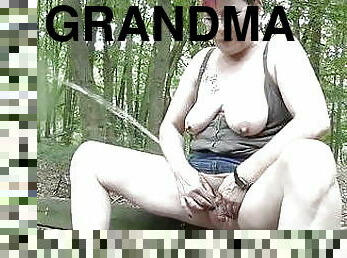 Grandma weeing in the woods