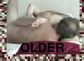 Older couple in sweet lovemaking