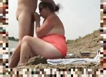 Fat wife having some sexy time on the beach with a hubby