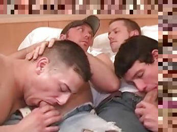 Four horny guys engage in hot group blowjob session on the bed