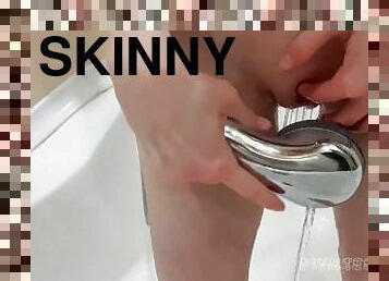 Very skinny teen girl takes a shower