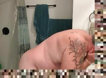 Dad bod shaving face and crotch