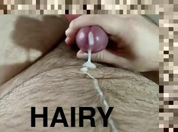 Hairy man moans and cums on himself