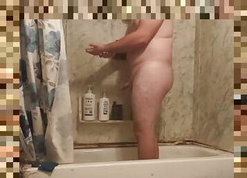 Fat guy jerks dick in shower and swallows own cum