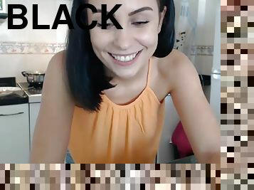 Black haired bombshell cooking on camera for her fans