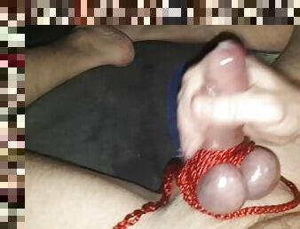 Wanking with tied balls