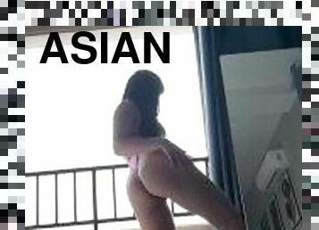 Single Asian model self-spanking and chair-riding