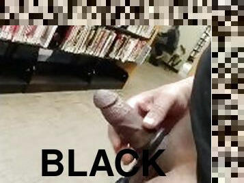 Hard black cock in the library