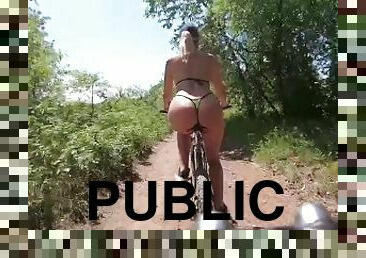 a bitch in a microbikini on a bicycle rides to fuck in the ass