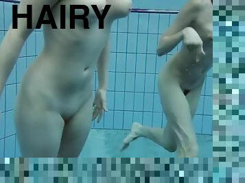 Two hot hairy babes underwater