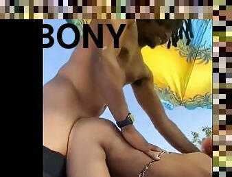 Ebony rides, sucks and gets fucked on the beach