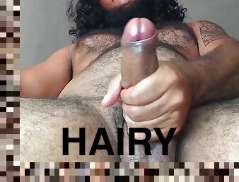 Hairy guy shoots a big load of cum