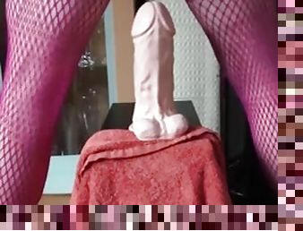 Sissy squirts piss through her cock cage while stretching her anal pussy with big toys