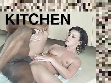 Sexy brunette is smashed by a bbc in the kitchen