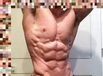 Jacked bodybuilder Benji Bastian flexing his huge, shredded, muscles