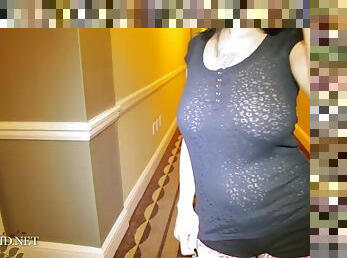 Teen babe with massive tits teasing in the hallway