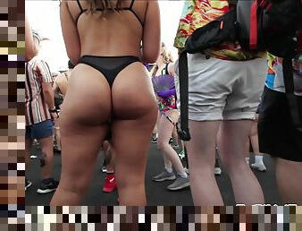 Phat ass Latina raver girl shaking her big ass cheeks at rave festival