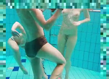 Three hot girls swim naked in the pool