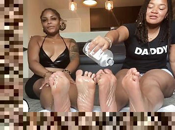 Oily soles rubbing feet and spreading toes