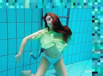 Hairy teen babe Nina Mokhnatka swims in the pool