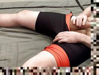 Horny beefy wrestler jerks off after practice in a singlet