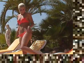 Horny blonde takes her bikini off and plays with herself
