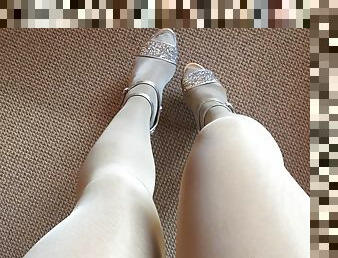 Leg tease in layerd shiny white crystal pantyhose and bright high heels.