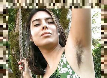 Plump brunette skank displays her hairy armpits and cunt outdoors