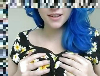 Blue haired girl in the flowers playing with tits