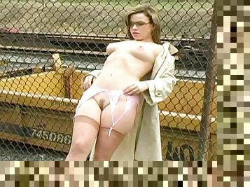 Kerie is demonstrating her boobies outdoors