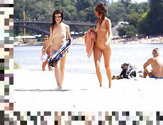 Petite nudist teenager enjoys a beautiful day at the beach